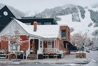 business in downtown aspen in the winter with snow